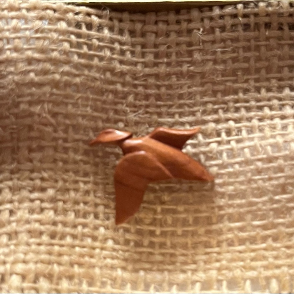 Hand carved tie tack